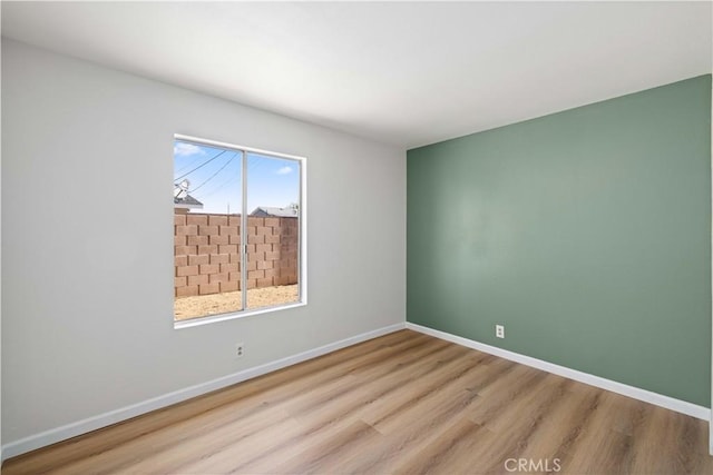 3316 Roxbury St, Rosamond, CA 93505 - empty room featuring wood finished floors and baseboards