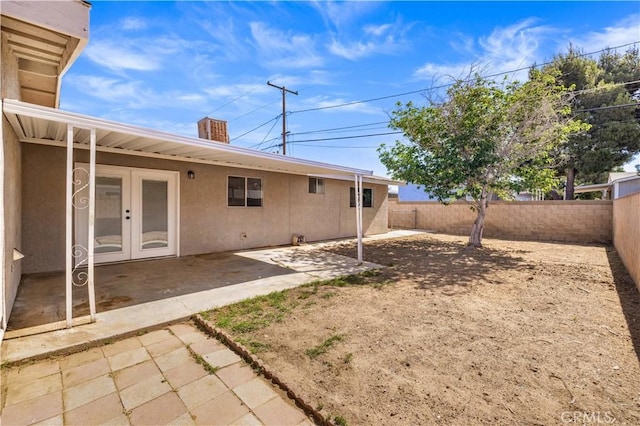 3316 Roxbury St, Rosamond, CA 93505 - fenced backyard featuring french doors and a patio area