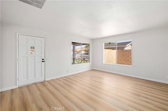 3316 Roxbury St, Rosamond, CA 93505 - empty room with light wood-style floors and baseboards