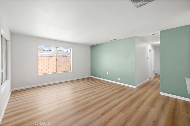 3316 Roxbury St, Rosamond, CA 93505 - unfurnished room with light wood-style floors and baseboards