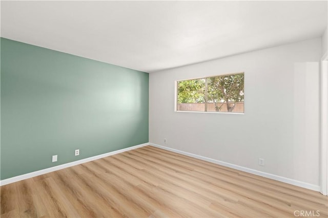 3316 Roxbury St, Rosamond, CA 93505 - empty room featuring light wood finished floors and baseboards