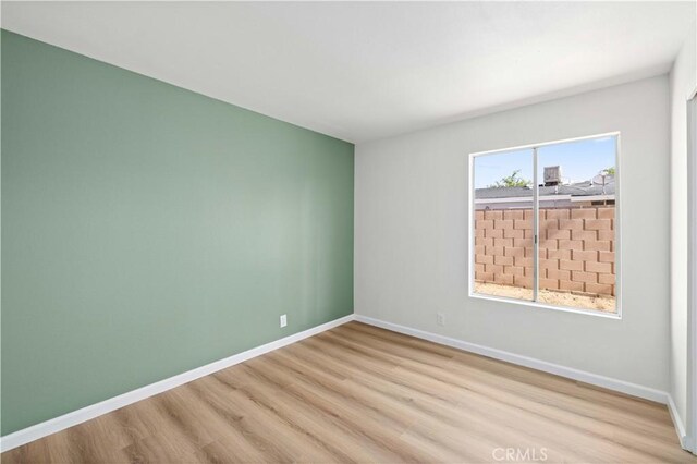 3316 Roxbury St, Rosamond, CA 93505 - empty room with wood finished floors and baseboards