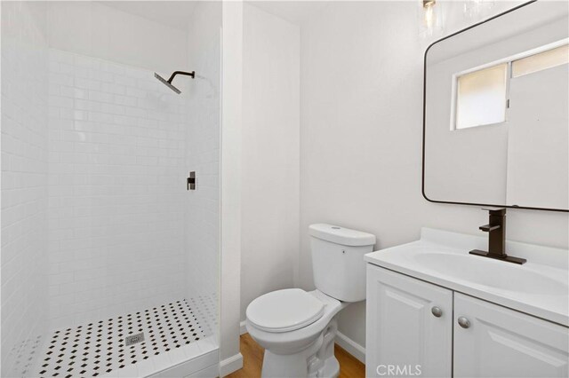 3316 Roxbury St, Rosamond, CA 93505 - full bathroom featuring vanity, a stall shower, and wood finished floors