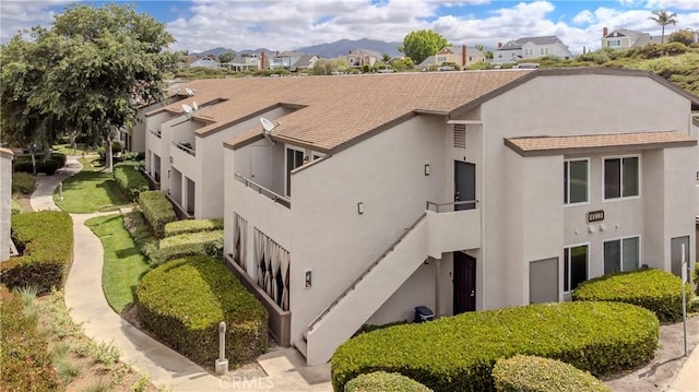 21981 Rimhurst Dr Unit 154, Lake Forest, CA 92630 - view of building exterior with a residential view