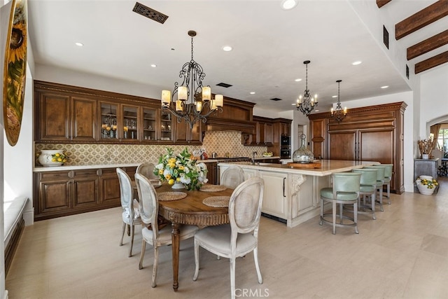 35 Shoreline Dr, Dana Point, CA 92629 - dining room featuring a chandelier, recessed lighting, and arched walkways