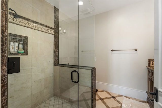 35 Shoreline Dr, Dana Point, CA 92629 - full bath featuring inlaid floor details, a shower stall, baseboards, and vanity
