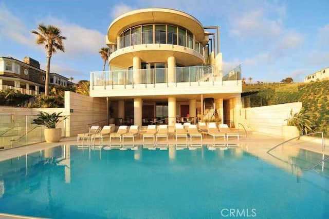 35 Shoreline Dr, Dana Point, CA 92629 - back of house with a balcony, a community pool, and a patio area