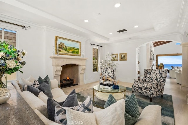 35 Shoreline Dr, Dana Point, CA 92629 - living area with arched walkways, healthy amount of natural light, a premium fireplace, recessed lighting, and light wood-style flooring