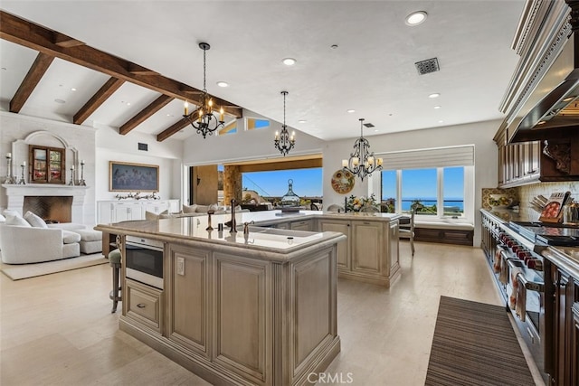 35 Shoreline Dr, Dana Point, CA 92629 - kitchen with a chandelier, ventilation hood, open floor plan, a spacious island, and recessed lighting