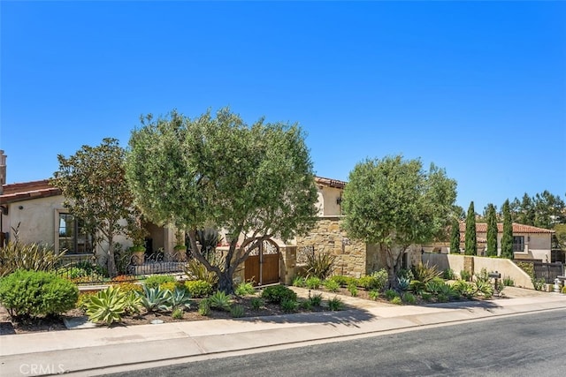 35 Shoreline Dr, Dana Point, CA 92629 - view of front of property featuring stucco siding, a tile roof, and stone siding