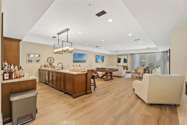 35 Shoreline Dr, Dana Point, CA 92629 - bar with light wood-style floors, a sink, a raised ceiling, recessed lighting, and pendant lighting