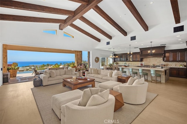 35 Shoreline Dr, Dana Point, CA 92629 - living area featuring a chandelier, beam ceiling, light wood-style floors, and high vaulted ceiling