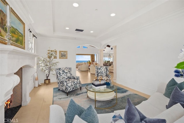 35 Shoreline Dr, Dana Point, CA 92629 - living area with decorative columns, a high end fireplace, arched walkways, a raised ceiling, and recessed lighting