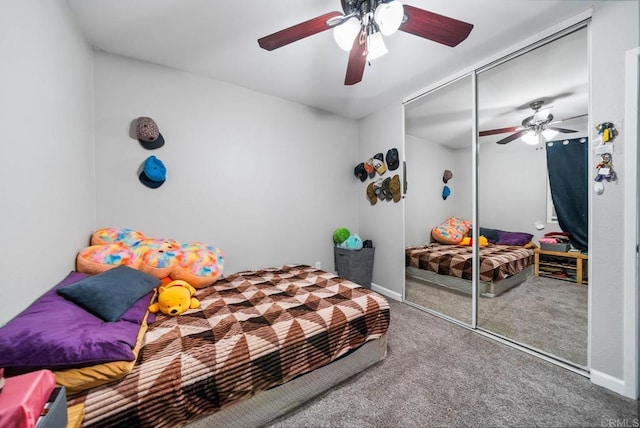 bedroom featuring carpet flooring, a closet, a ceiling fan, and baseboards