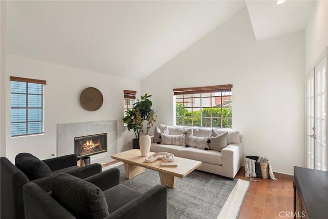 2405 Marshallfield Ln Unit B, Redondo Beach, CA 90278 - living room with high vaulted ceiling, plenty of natural light, wood finished floors, a fireplace, and baseboards