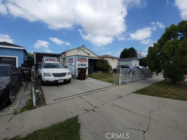 1307 S Grandee Ave, Compton, CA 90220 - view of front facade featuring driveway and fence