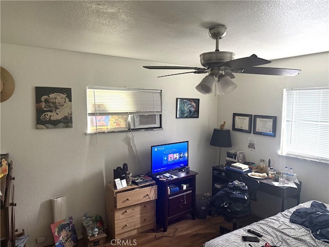 106 N Encina Ave, Rialto, CA 92376 - bedroom with multiple windows, wood finished floors, a textured ceiling, a ceiling fan, and cooling unit