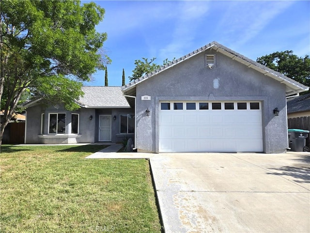 225 Sparrow Ct, Red Bluff, CA 96080 - ranch-style home featuring concrete driveway, stucco siding, an attached garage, and a front yard