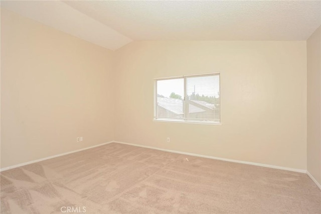 1536 Granicy Dr, Lancaster, CA 93535 - spare room with vaulted ceiling, light carpet, and baseboards