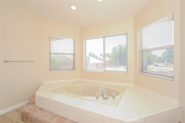 1536 Granicy Dr, Lancaster, CA 93535 - bathroom with healthy amount of natural light, a bath, recessed lighting, and baseboards
