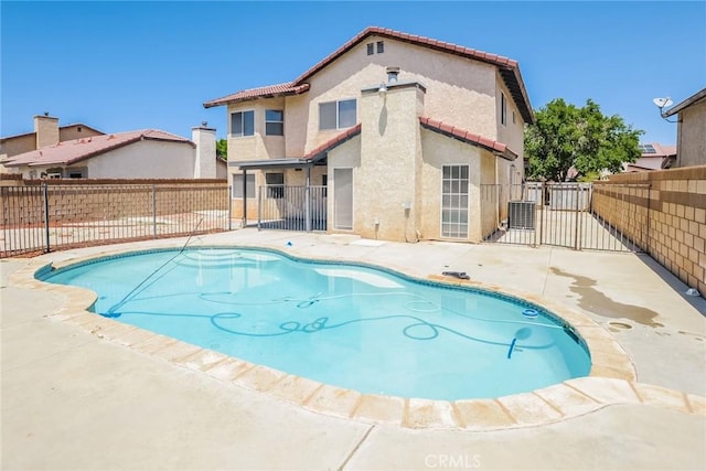 1536 Granicy Dr, Lancaster, CA 93535 - view of swimming pool featuring a fenced backyard, a patio, a gate, and central air condition unit