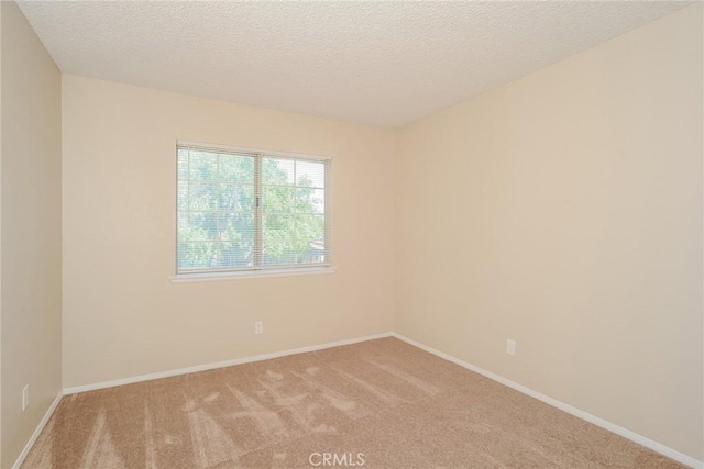 1536 Granicy Dr, Lancaster, CA 93535 - unfurnished room featuring carpet flooring, baseboards, and a textured ceiling