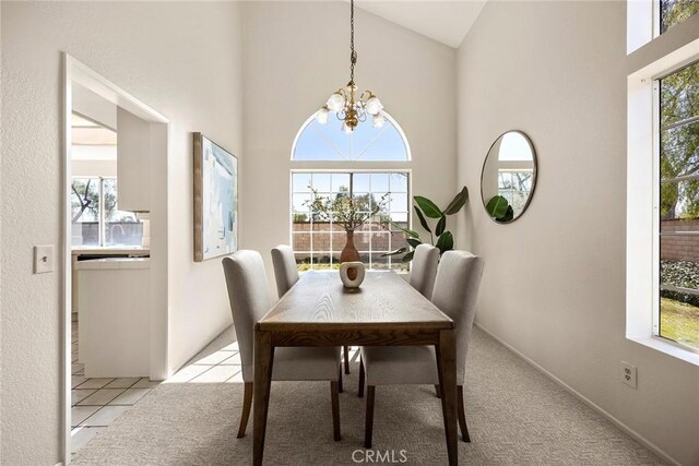 13639 Meadow Crest Dr, Chino Hills, CA 91709 - dining room featuring a chandelier, light carpet, and high vaulted ceiling