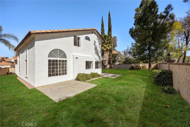 13639 Meadow Crest Dr, Chino Hills, CA 91709 - back of property with stucco siding, a tiled roof, and a patio area
