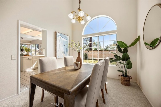 13639 Meadow Crest Dr, Chino Hills, CA 91709 - dining space featuring a chandelier, light carpet, and baseboards