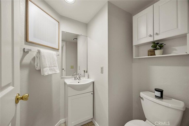13639 Meadow Crest Dr, Chino Hills, CA 91709 - half bath with toilet, vanity, and baseboards