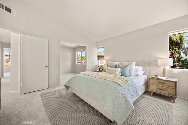13639 Meadow Crest Dr, Chino Hills, CA 91709 - bedroom with light carpet, multiple windows, lofted ceiling, and baseboards