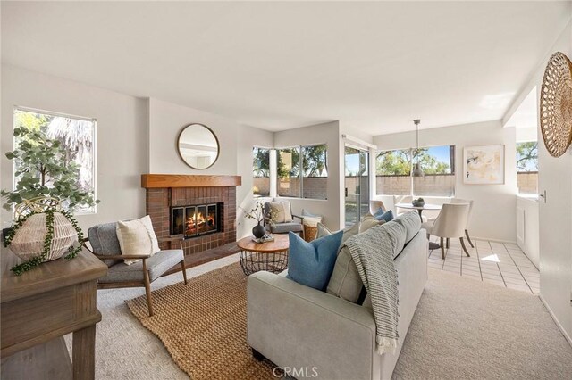 13639 Meadow Crest Dr, Chino Hills, CA 91709 - living area with a fireplace, baseboards, light carpet, and light tile patterned flooring