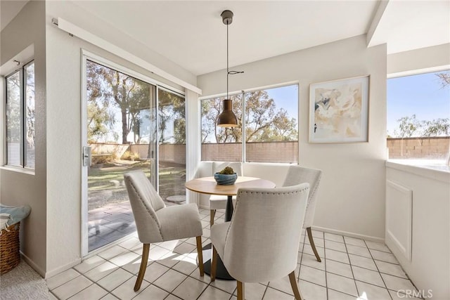 13639 Meadow Crest Dr, Chino Hills, CA 91709 - dining room featuring plenty of natural light, light tile patterned flooring, and baseboards