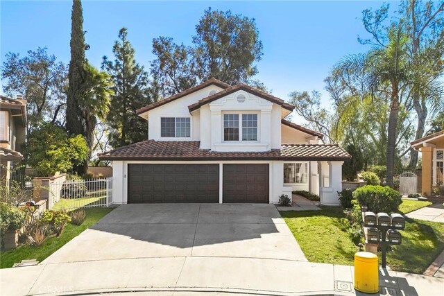 13639 Meadow Crest Dr, Chino Hills, CA 91709 - mediterranean / spanish house with concrete driveway, stucco siding, a tile roof, and an attached garage