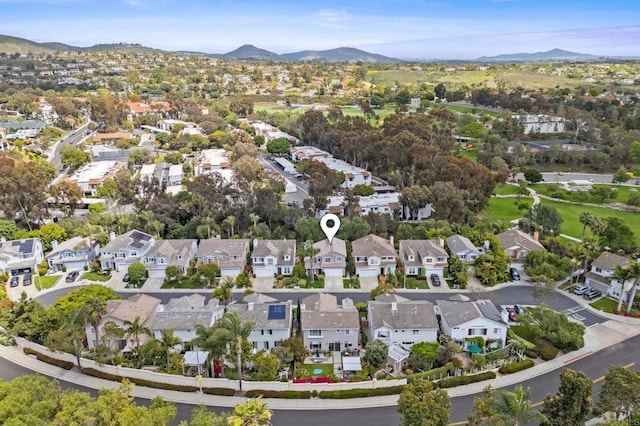 7794 Paseo La Jolla, Carlsbad, CA 92009 - aerial overview of property's location featuring a mountainous background and nearby suburban area
