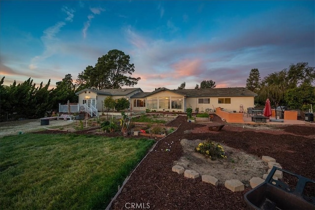 1561 Cielo Ln, Nipomo, CA 93444 - yard at dusk with a patio area, a yard, and a garden