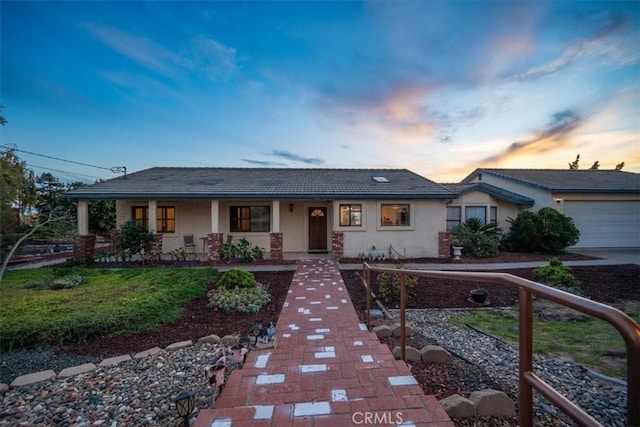 1561 Cielo Ln, Nipomo, CA 93444 - ranch-style house with stucco siding, an attached garage, and a porch