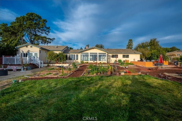 1561 Cielo Ln, Nipomo, CA 93444 - back of property with a garden, a lawn, a sunroom, and stucco siding
