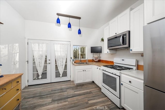 1561 Cielo Ln, Nipomo, CA 93444 - kitchen featuring appliances with stainless steel finishes, french doors, dark wood-style floors, and light countertops