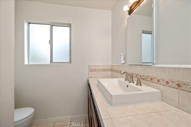 1561 Cielo Ln, Nipomo, CA 93444 - half bathroom with vanity, toilet, and tile patterned flooring