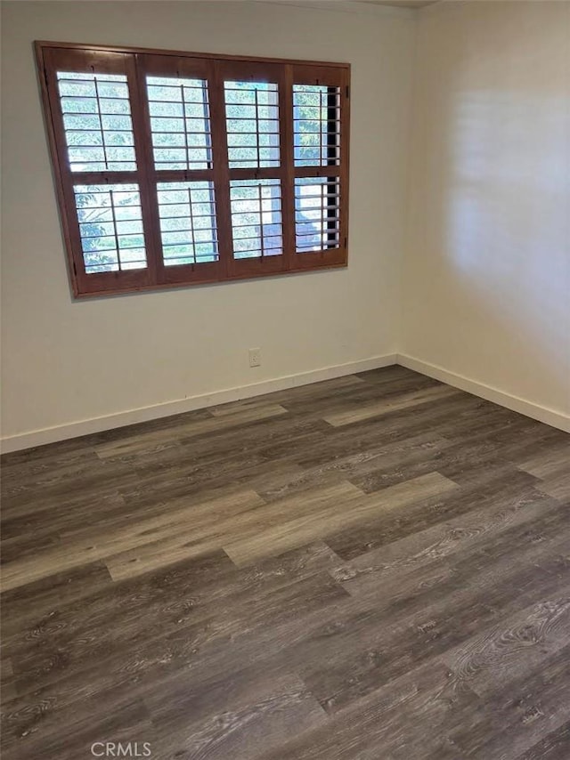 1561 Cielo Ln, Nipomo, CA 93444 - unfurnished room with baseboards and dark wood-style flooring