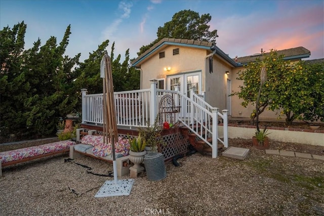 1561 Cielo Ln, Nipomo, CA 93444 - view of front of house with a deck, french doors, and stucco siding