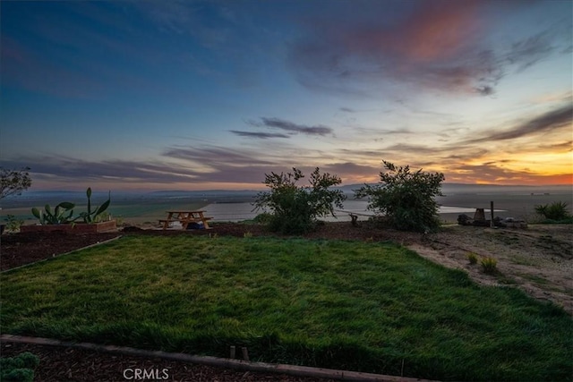 1561 Cielo Ln, Nipomo, CA 93444 - yard at dusk featuring a water view and a yard