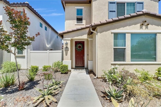 1952 Hazel Olson Ln, Colton, CA 92324 - property entrance with stucco siding, fence, and a tile roof