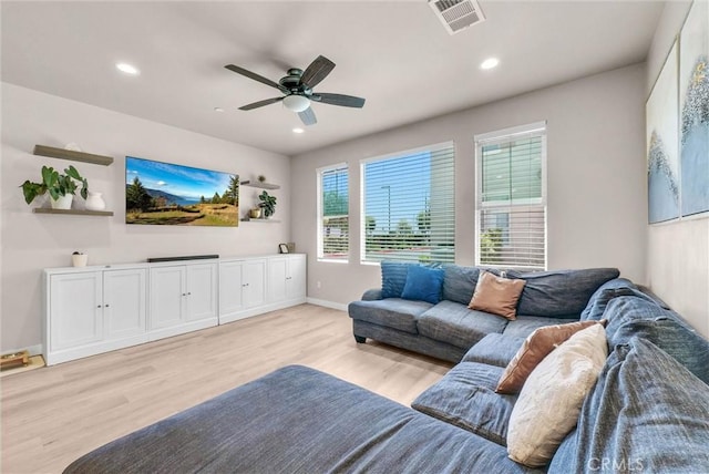 1952 Hazel Olson Ln, Colton, CA 92324 - living room featuring light wood-style flooring, a ceiling fan, recessed lighting, and baseboards
