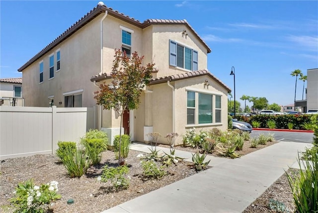 1952 Hazel Olson Ln, Colton, CA 92324 - rear view of property with stucco siding, fence, and a tile roof
