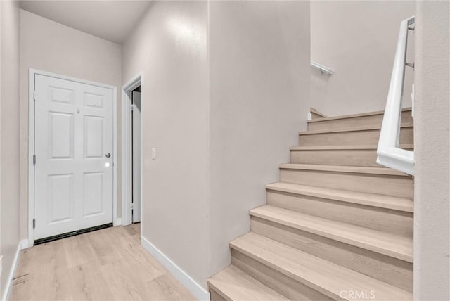 1952 Hazel Olson Ln, Colton, CA 92324 - staircase with baseboards and wood finished floors