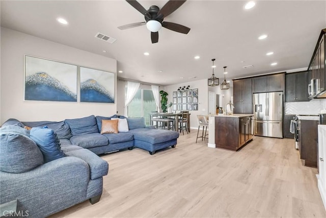 1952 Hazel Olson Ln, Colton, CA 92324 - living room featuring recessed lighting, ceiling fan, baseboards, and light wood-style floors