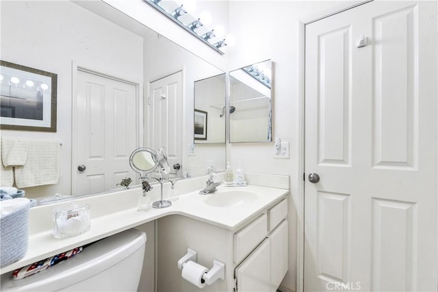 4591 Warner Ave Unit 105, Huntington Beach, CA 92649 - bathroom featuring toilet and vanity