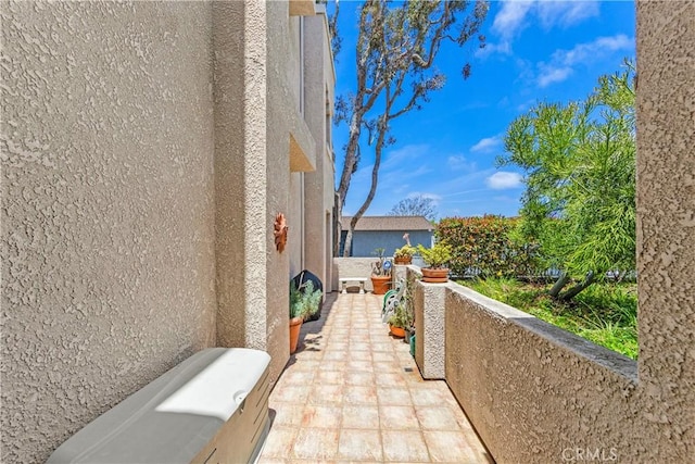 4591 Warner Ave Unit 105, Huntington Beach, CA 92649 - view of patio / terrace featuring a balcony